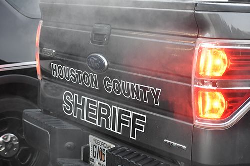Photo of back of truck with black letters spelling out "Houston County Sheriff"