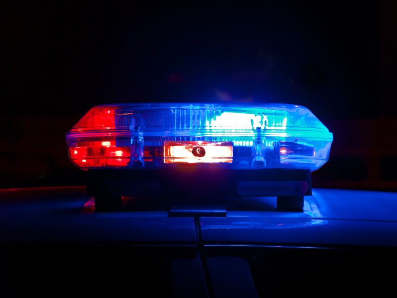 Photo of red and blue siren lights.