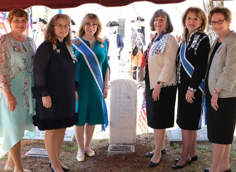 Seven women of the Sukey Hart, Mary Hammond Washington, and Nathaniel Macon Chapters of the Daughters of the American Revolution, along with the President General, Chaplain General, and Georgia State 1st Vice Regent, attend a grave marking ceremony in Lizella Sunday, March 24.