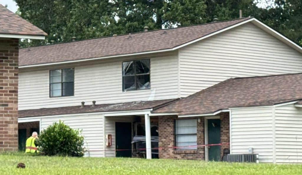 damaged apartment building where the car struck
