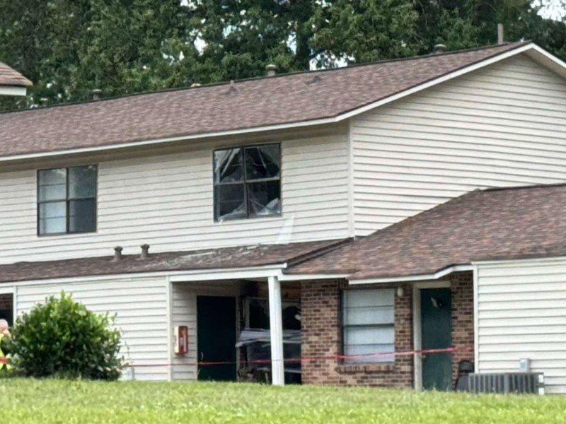 damaged apartment building where the car struck
