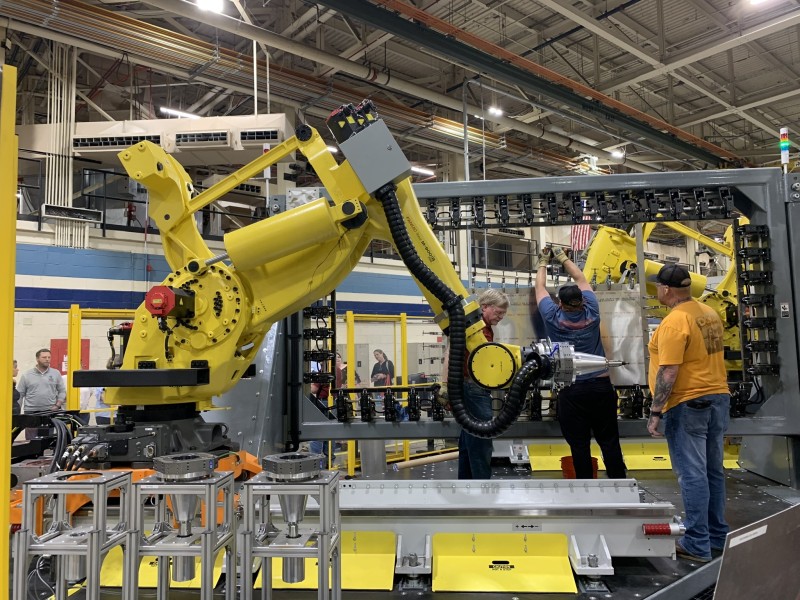 men at Robins Air Force Base working on some kind of machinery