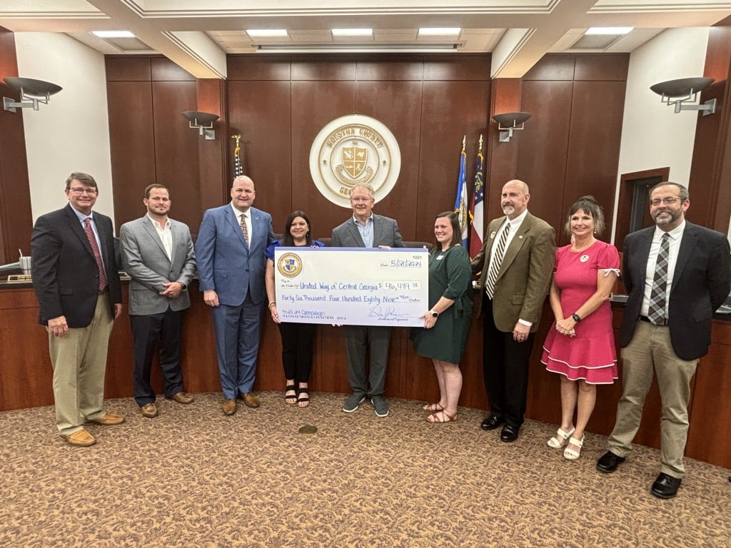 County Commissioners and representatives of United Way pose for picture with a big check in the middle
