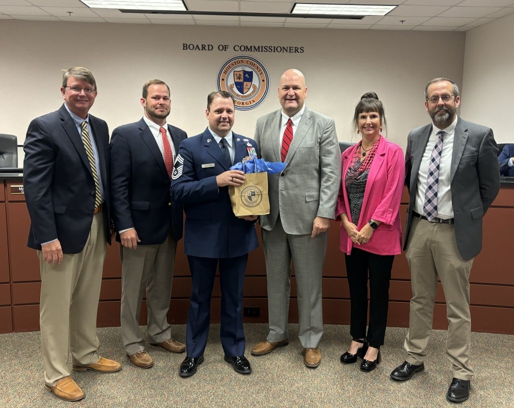 County Commissioners pose for a picture with the military speker