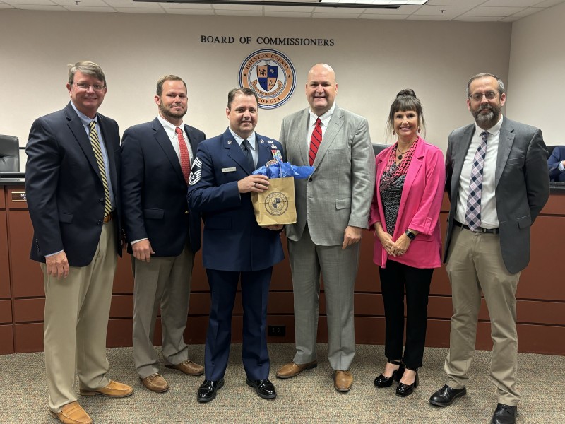County Commissioners pose for a picture with the military speker