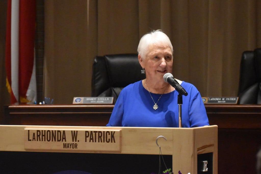 Women standing at podium 