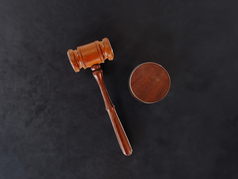 a gavel on a dark background