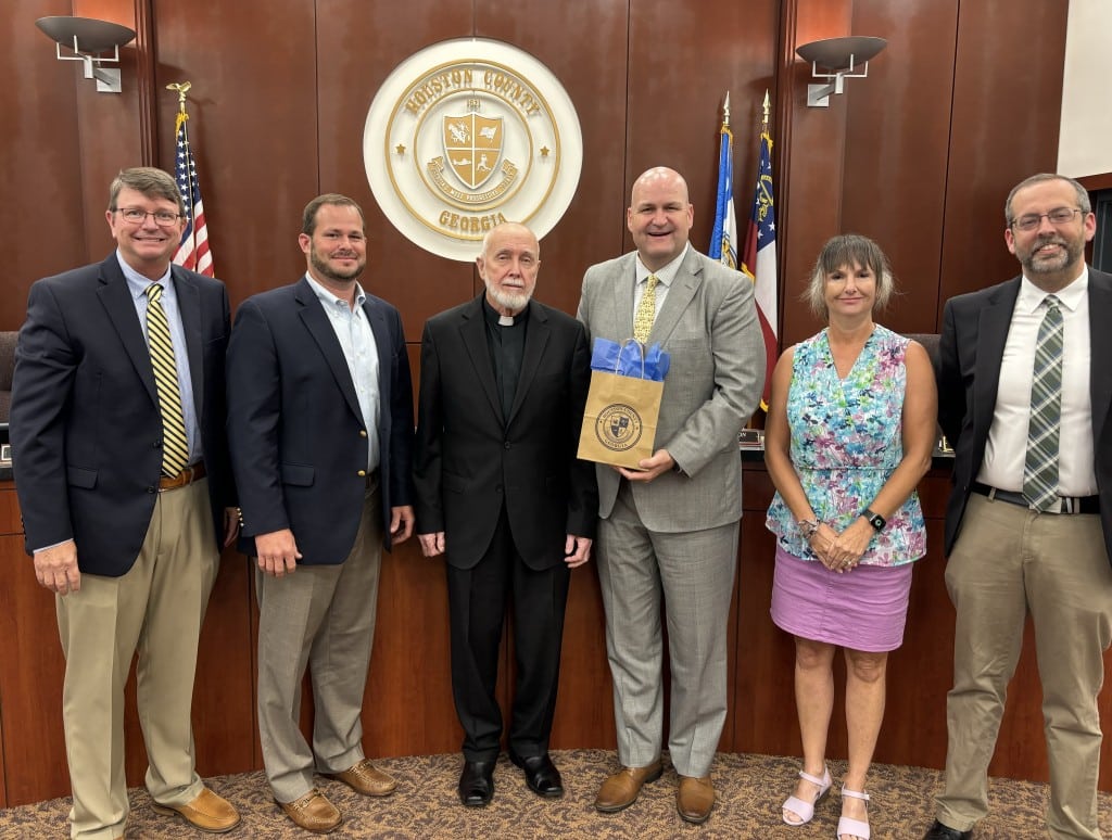 group of 5 men, one woman