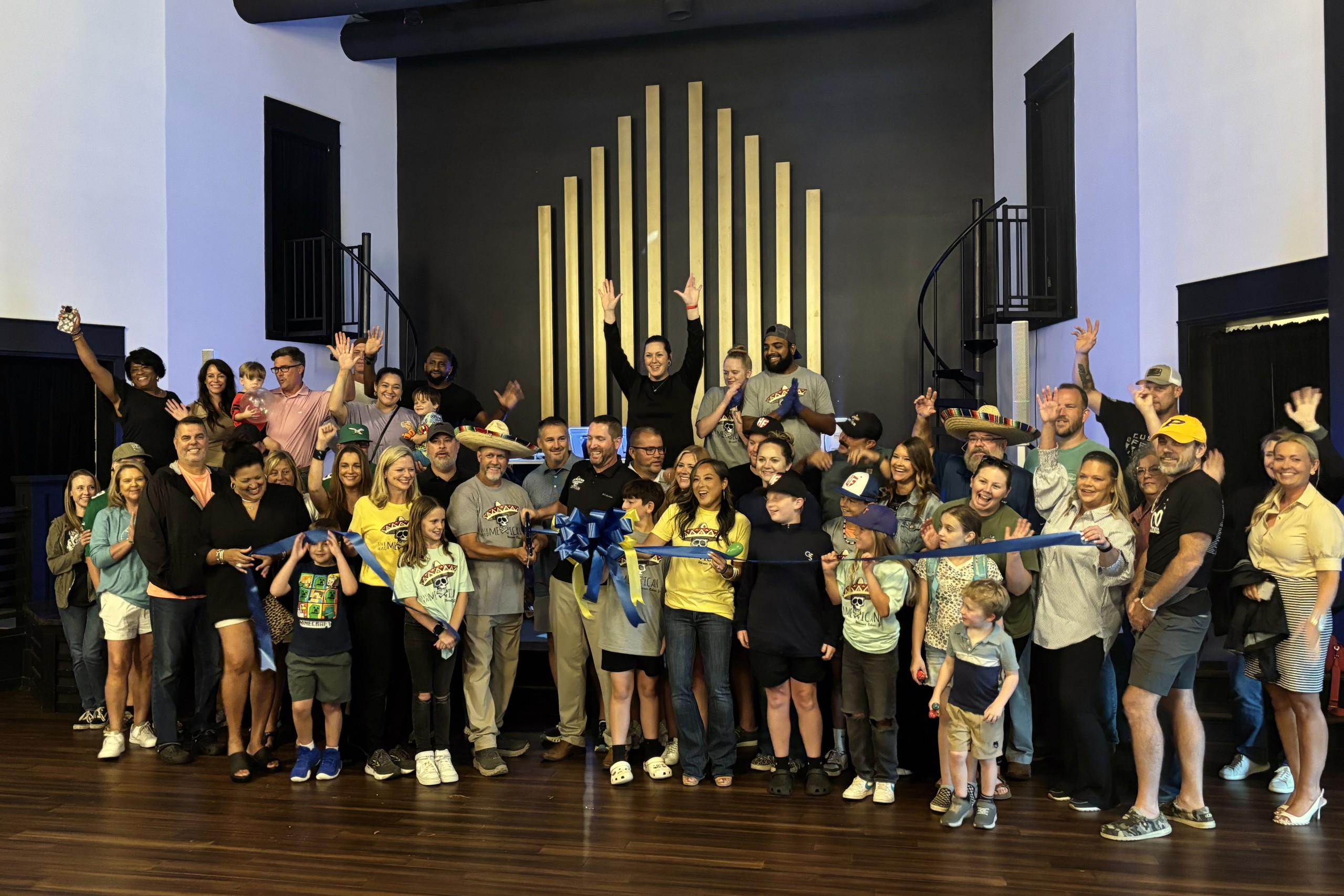 group of people celebrating ribbon cutting of Mad Mexican - Warner Robins