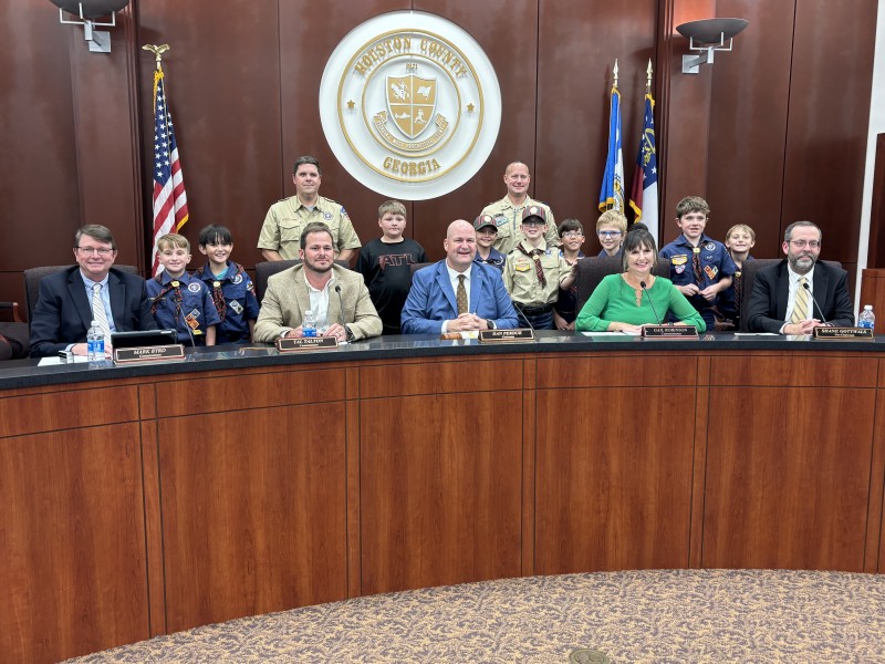 group of boy scouts takes picture with County Commissioners