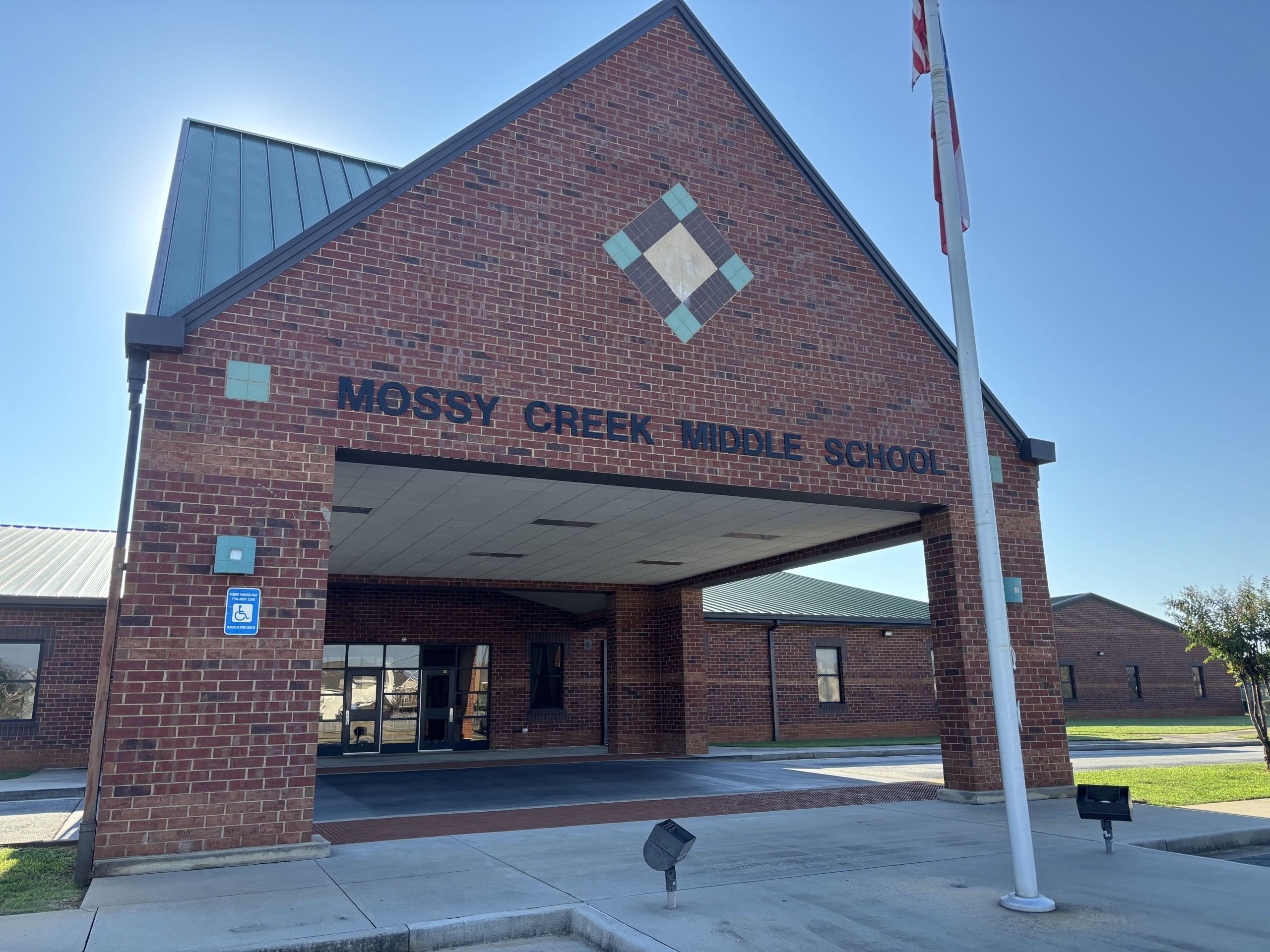 Mossy Creek Middle School: brick building with a flagpole in front of the building