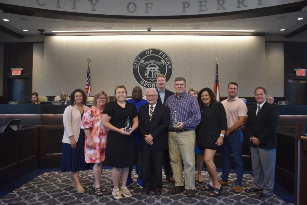 A group of people smiling for the camera.