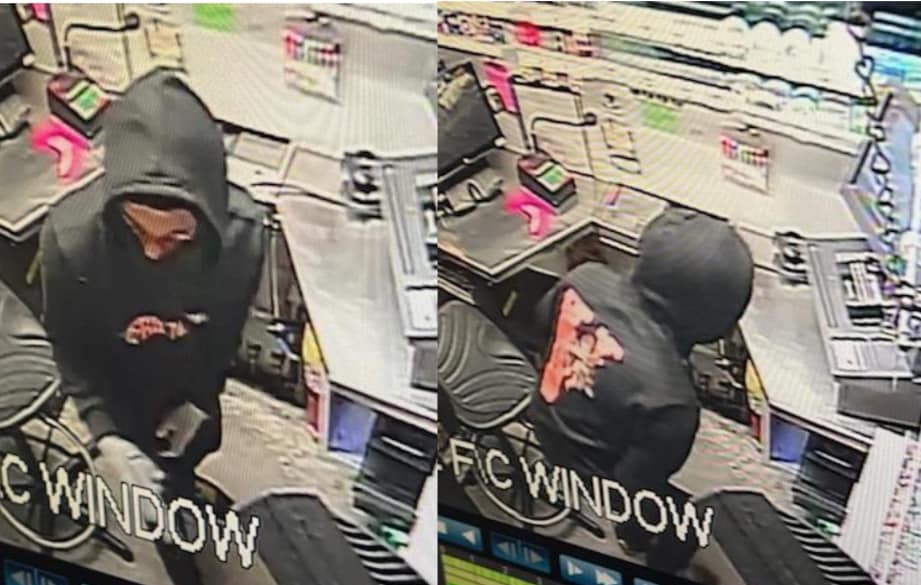 Two security camera images of a person in a black hoodie with a red and white graphic on the front and back, standing behind a counter in what appears to be a store or gas station. The person is facing downward and wearing gloves. Various cash registers, counters, and shelves with items are visible in the background. 