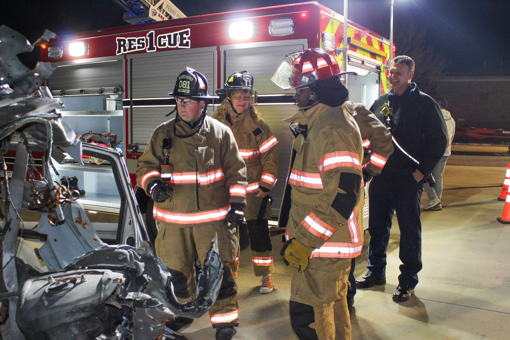 People in firefighters uniform taking a class.