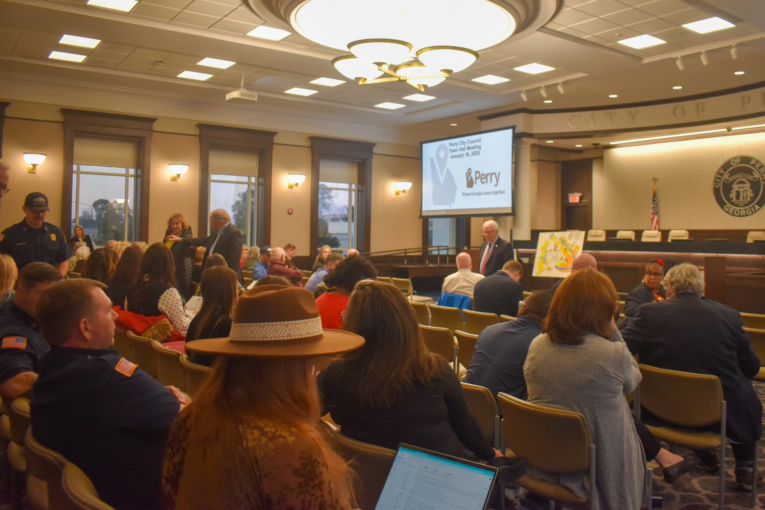 A group of people sitting in a room
