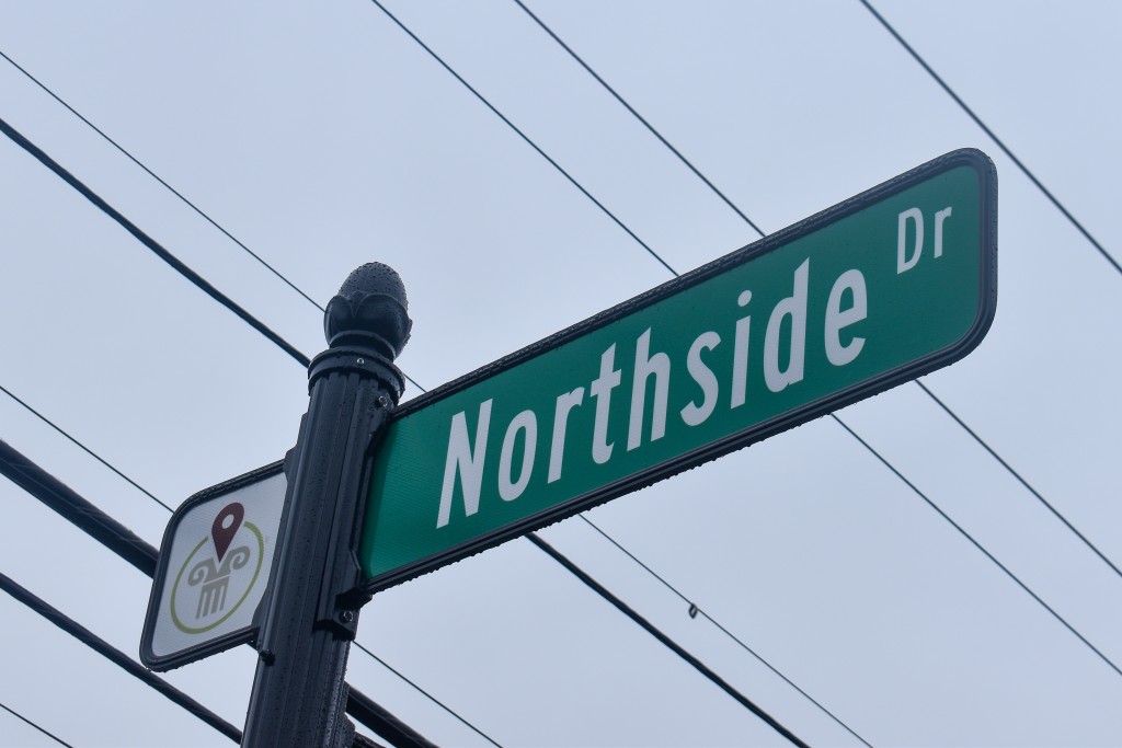A street sign with "Northside Dr" written in white letters.
