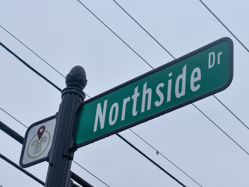 A street sign with "Northside Dr" written in white letters.