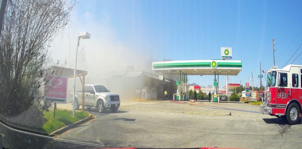 White smoke covering a building. A fire truck is seen.