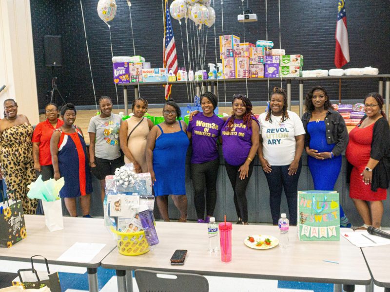 A group of women smiling.