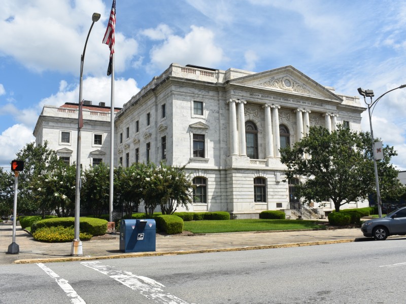 A tall white building.