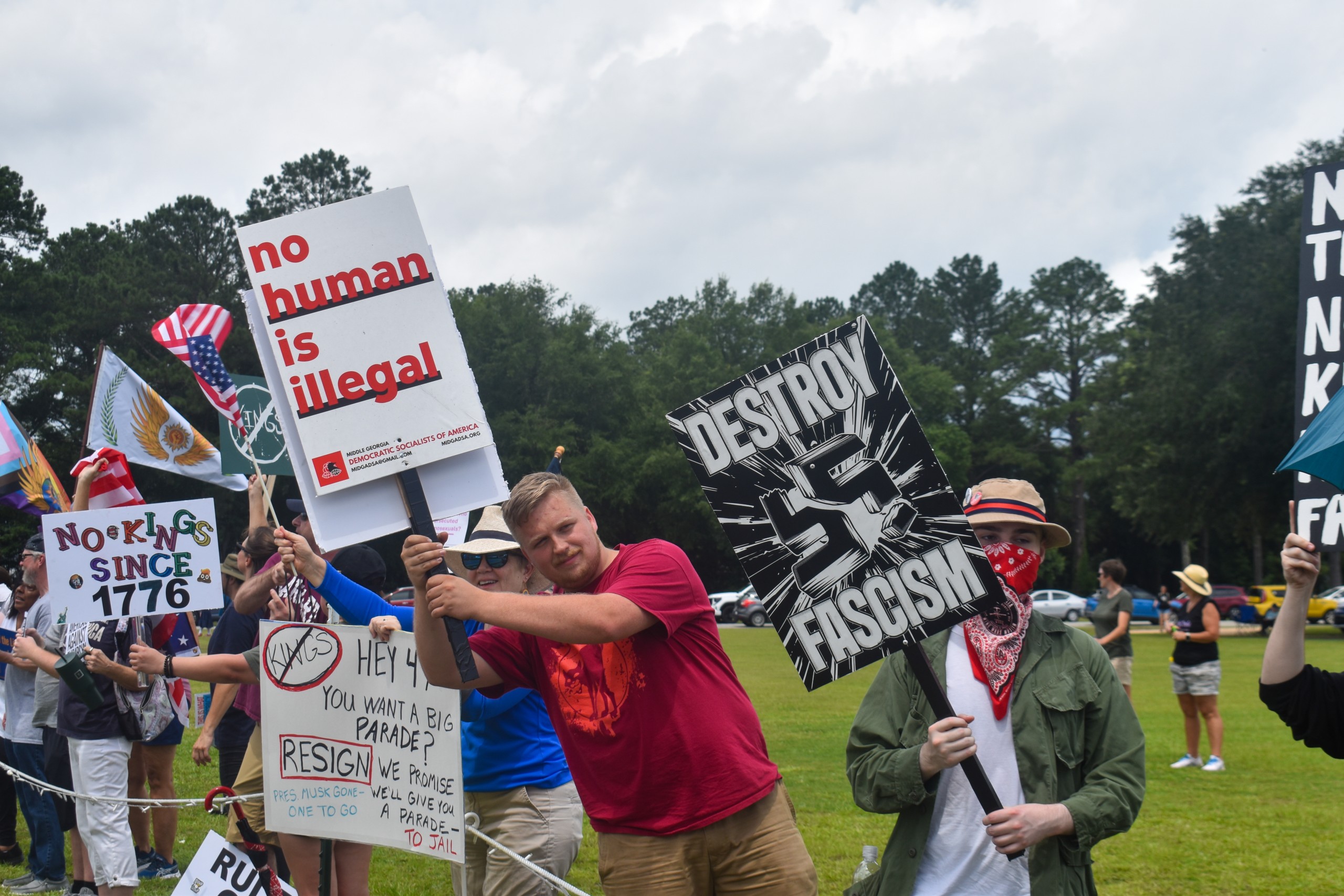 People standing and holding signs.