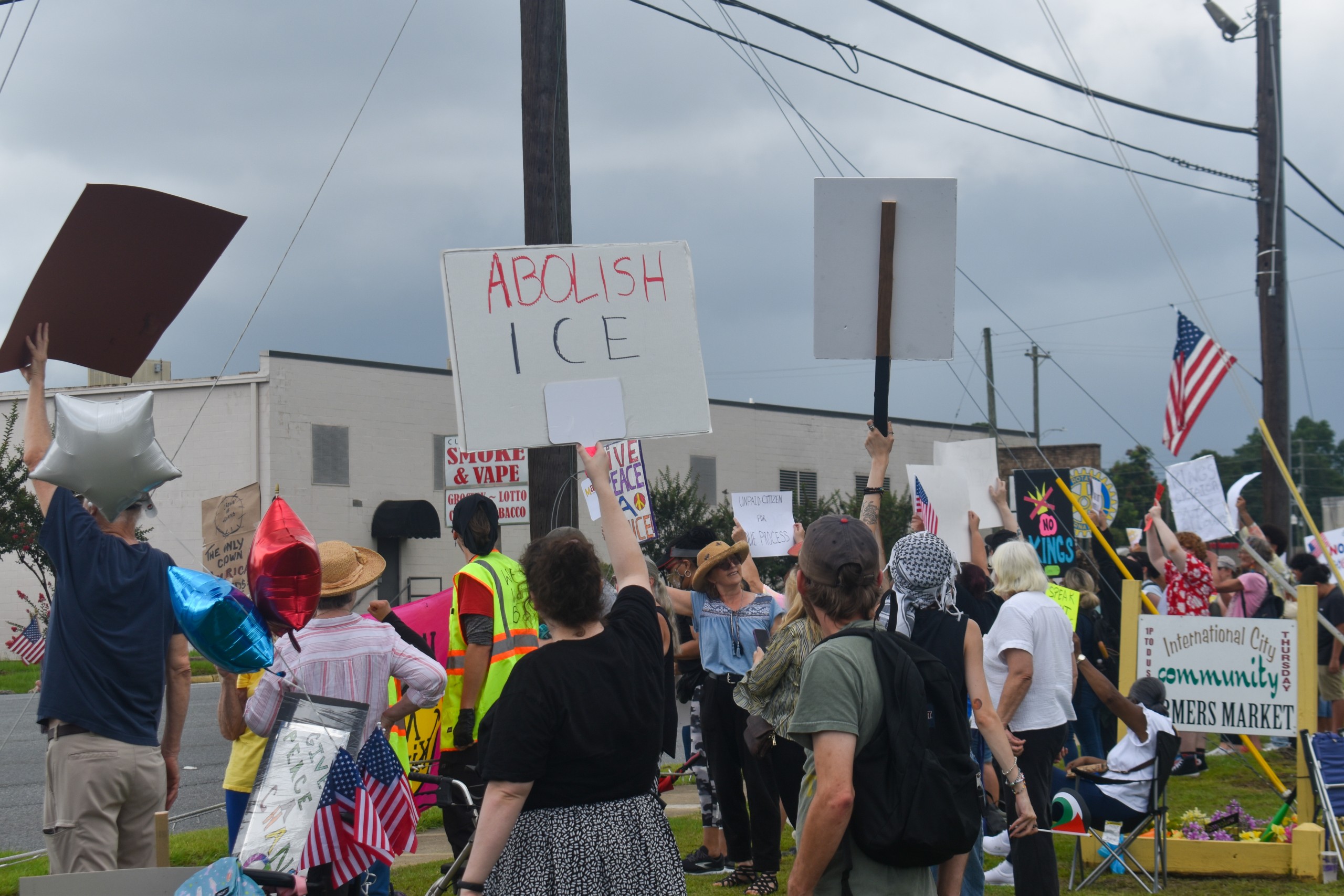 A group of people holding up signs with various messages.