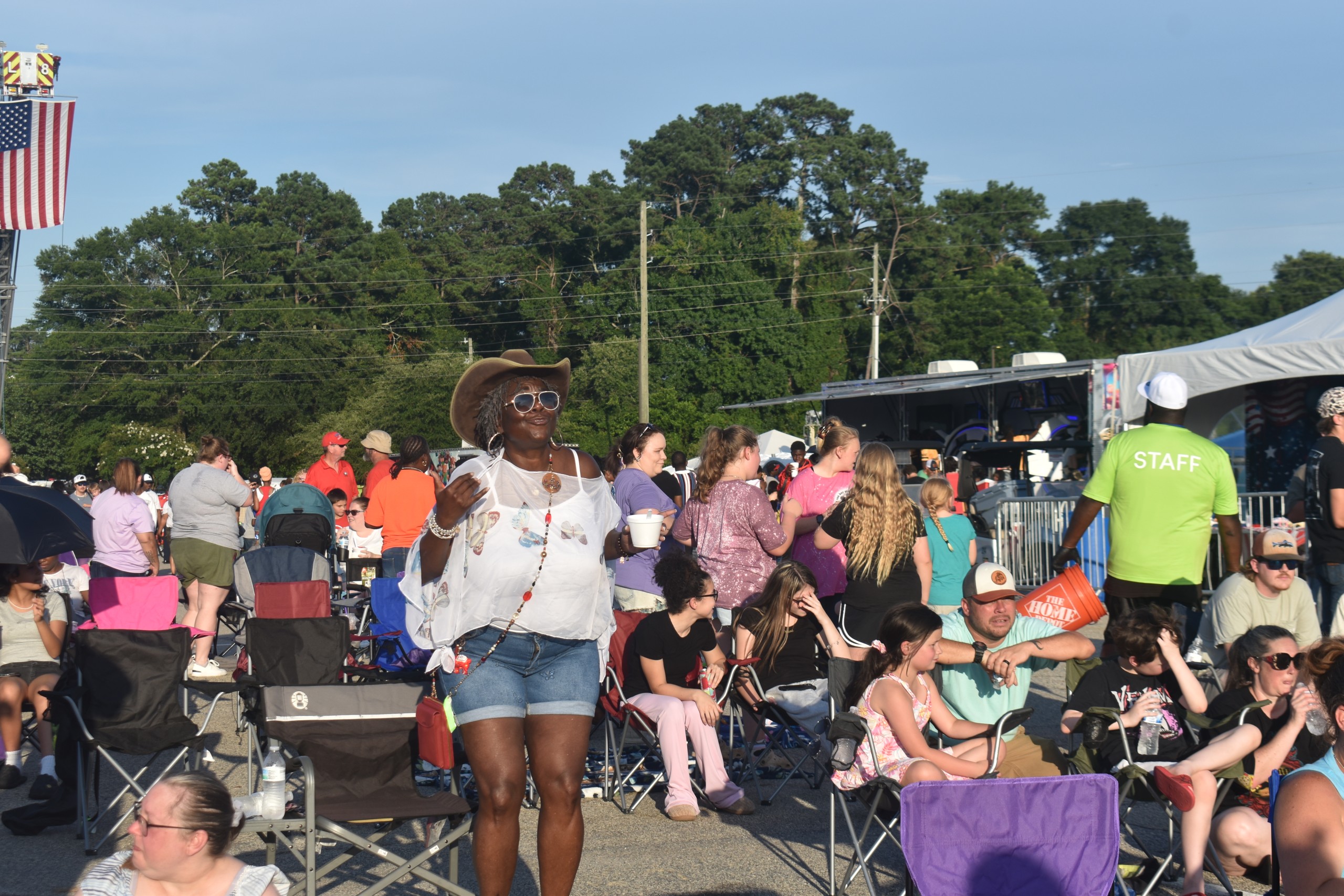 A women wearing a cowboy hat dancing.