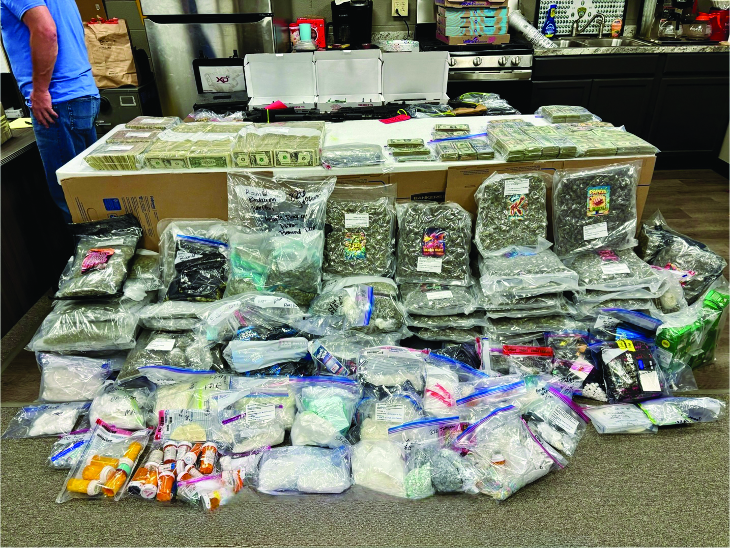 bunch of drugs laid out as part of a major drug bust