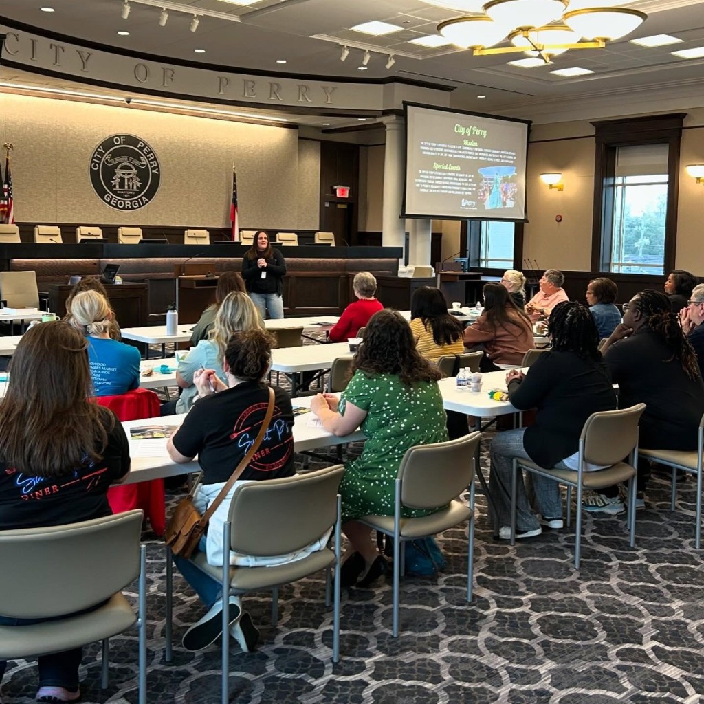 A group of people sitting down at a table. 