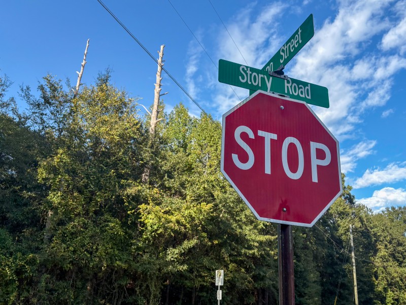 stop sign with Story Road sign