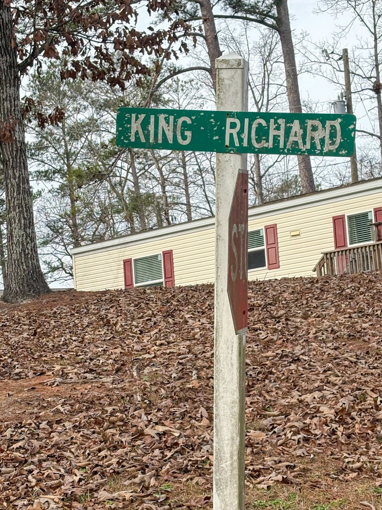 A green street sign with white letters. 