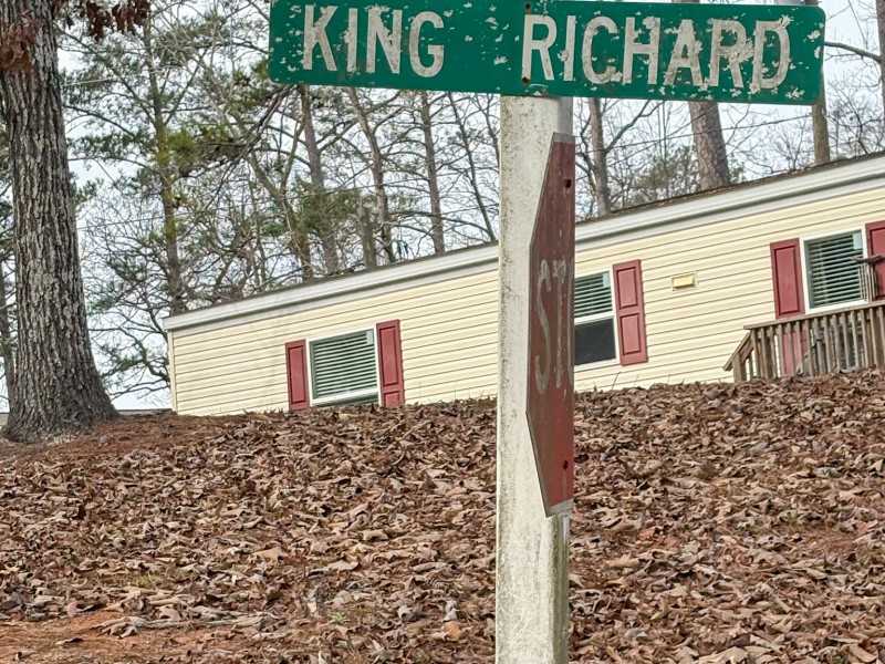 A green street sign with white letters.