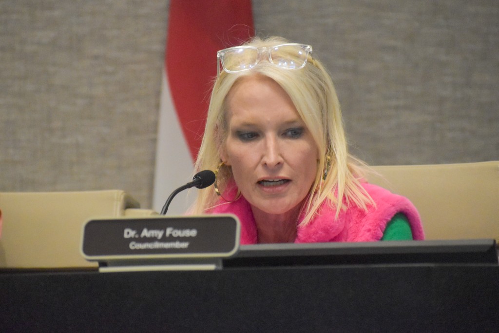 A woman speaking into a microphone. 