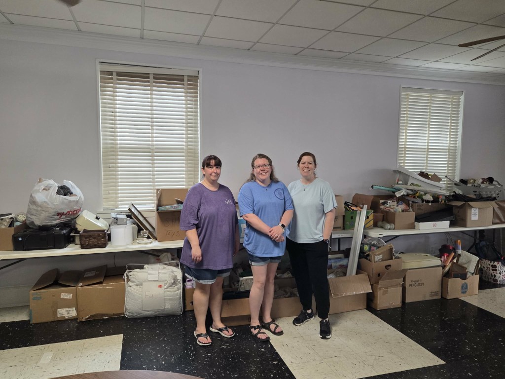 Three women smiling.