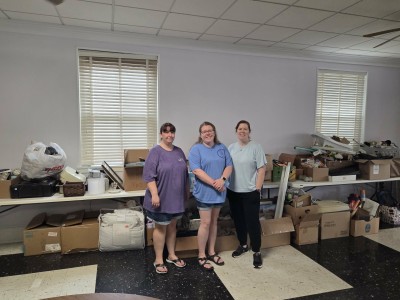 Three women smiling.