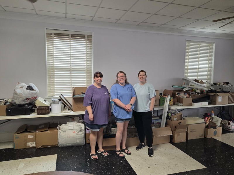 Three women smiling.