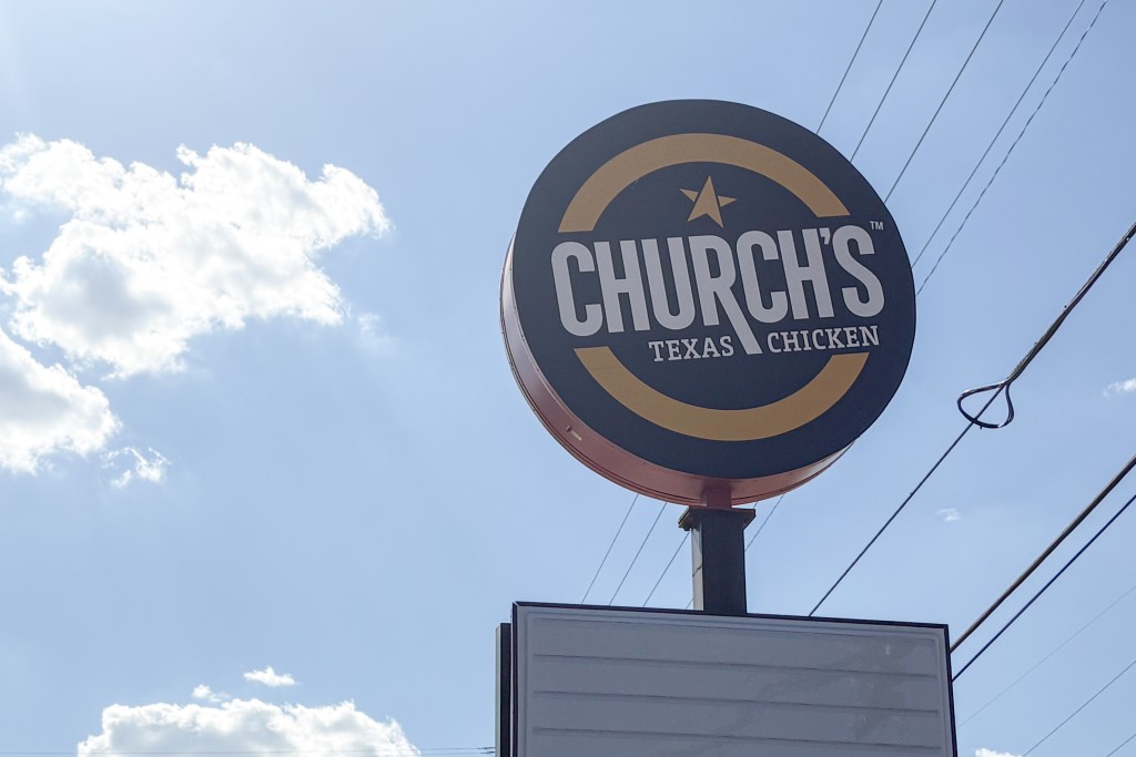 A photo of the Church's Chicken sign. 