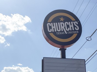 A photo of the Church's Chicken sign.