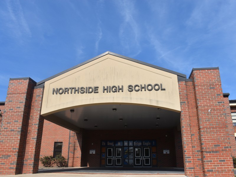 A brick building with lettering that says, "Northside High School."