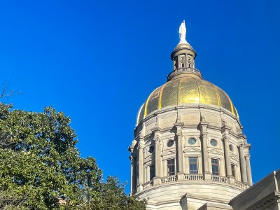 A tall building with a golden dome.