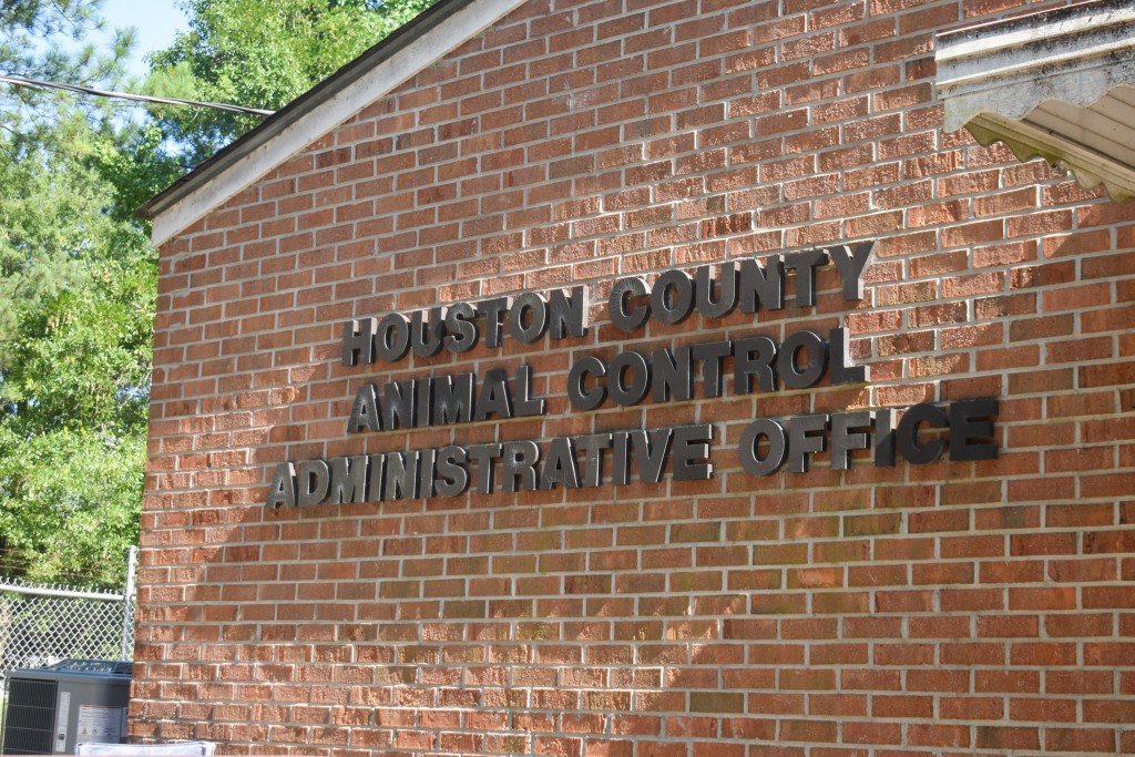 A bricked building with black letters.