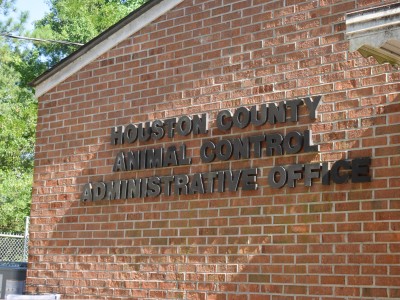 A bricked building with black letters.
