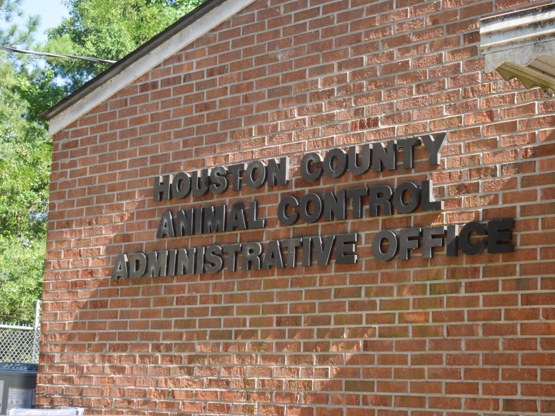 A bricked building with black letters.