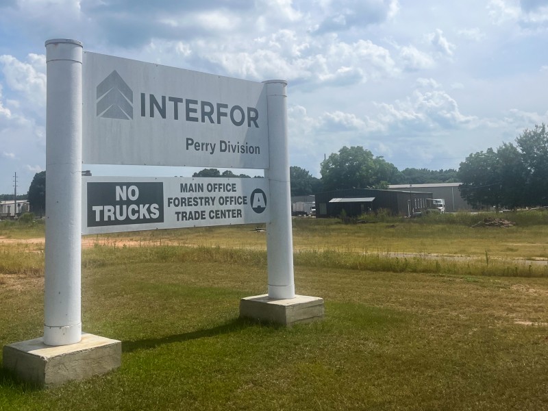 A white sign with black lettering.