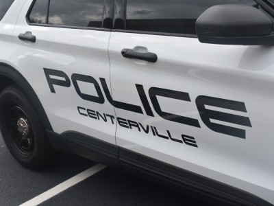 A white vehicle with black lettering.
