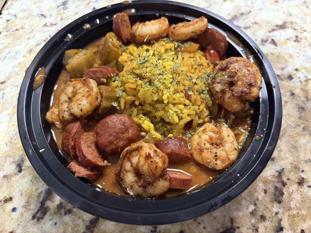 A bowl of gumbo with yellow rice, shrimp and beef sausage from Taste Good Restaurant.